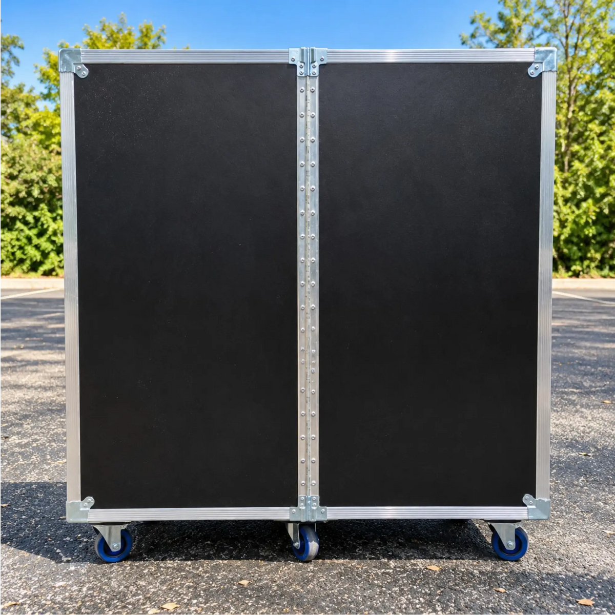 Black 2-sided 20x20x46 utility trunk case, closed back view showing continuous piano hinge and blue casters