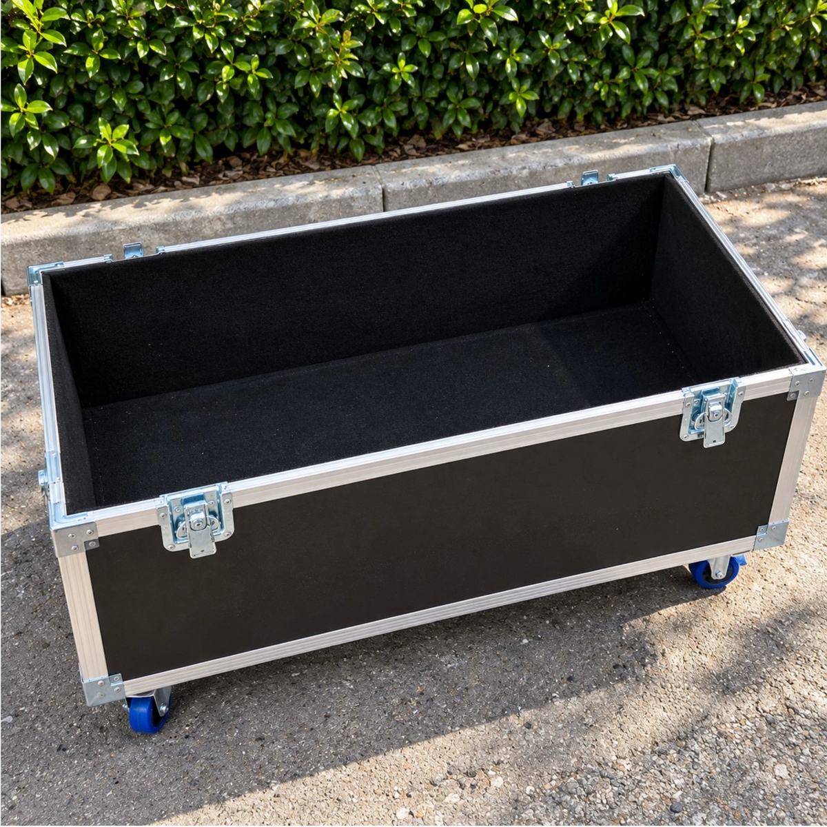Black equipment supply ATA trunk, wide open top view displaying spacious interior storage compartment