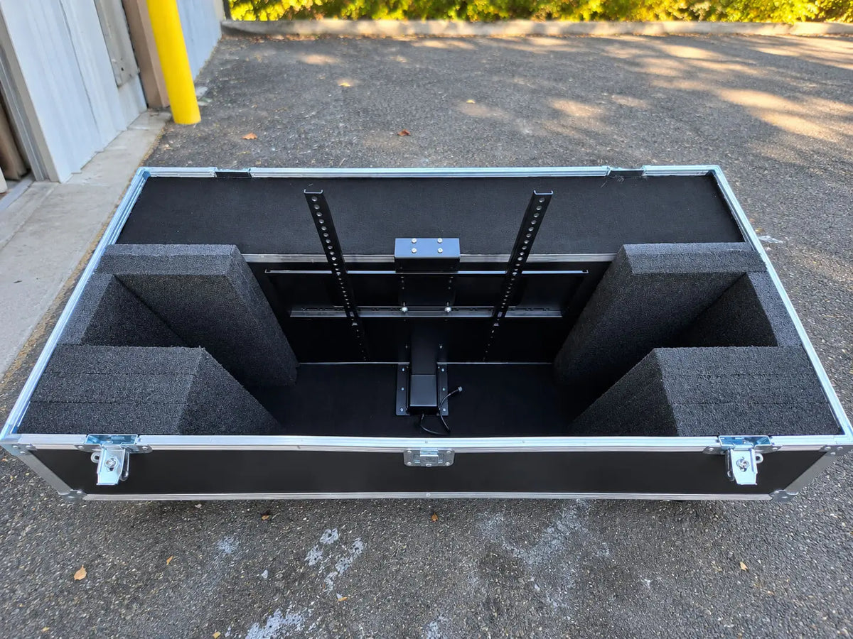 Black 42"-50" TV ATA case with electric lift, open front view showing internal foam padding and mounting system
