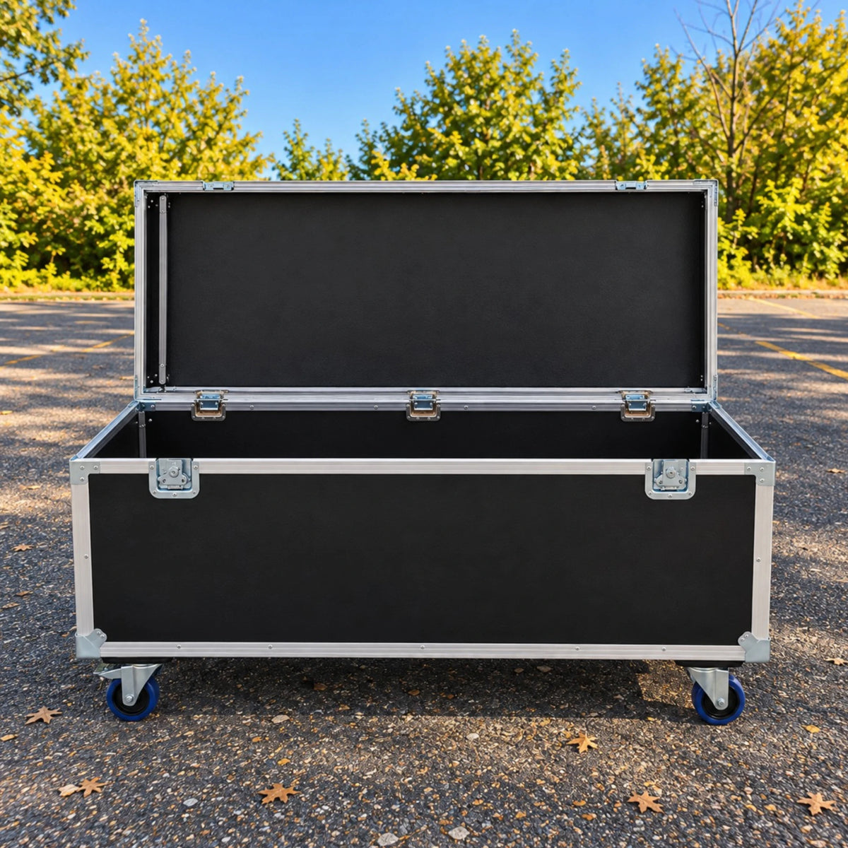 Black extra long ATA cable trunk, open view showing bare interior finish and blue swivel casters