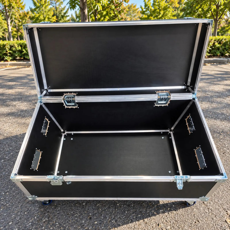 Black jumbo ATA cable trunk, wide open front view showing spacious barewood interior and heavy-duty lid stays