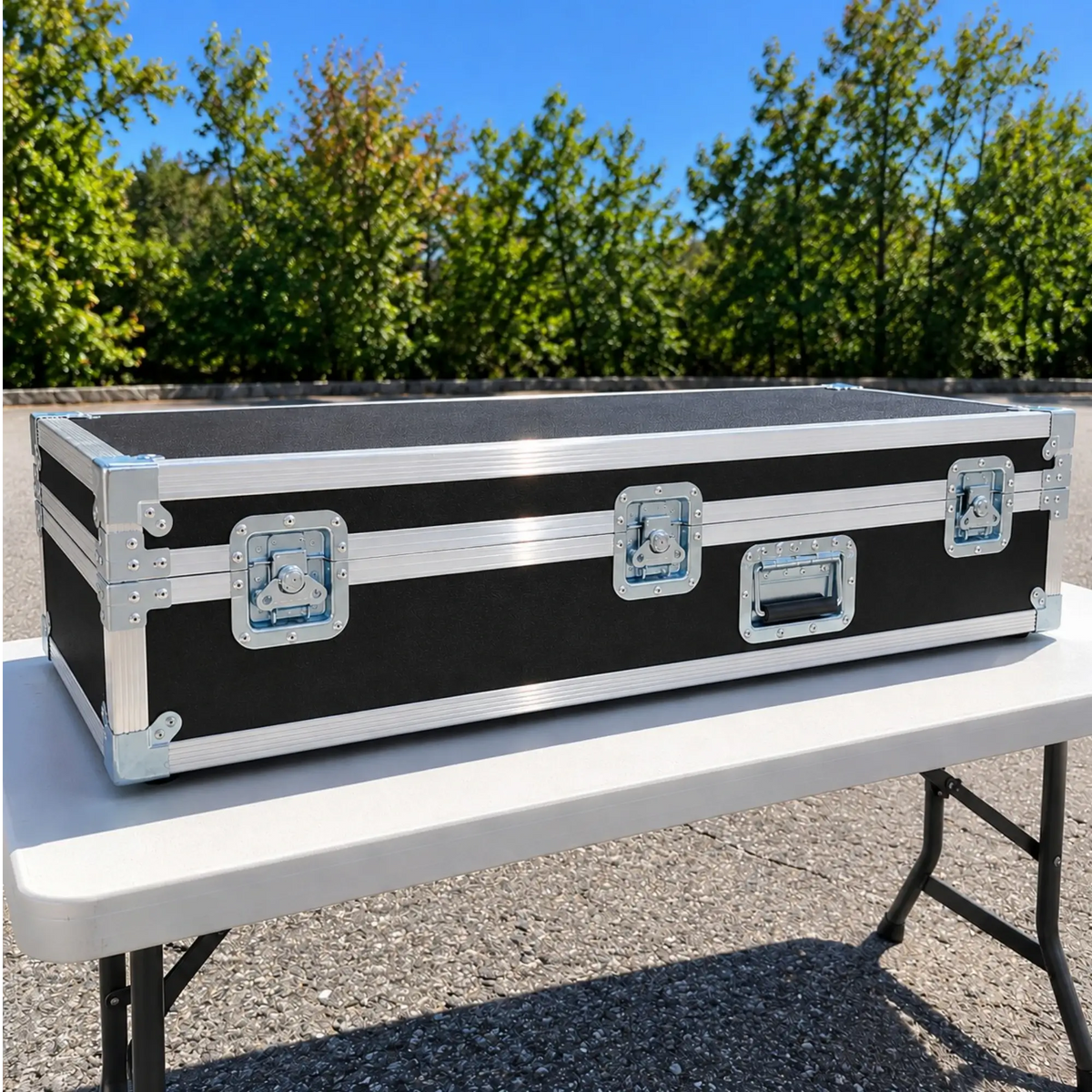 Black custom keyboard ATA case, closed front view showing heavy-duty twist latches, spring handles, and aluminum trim